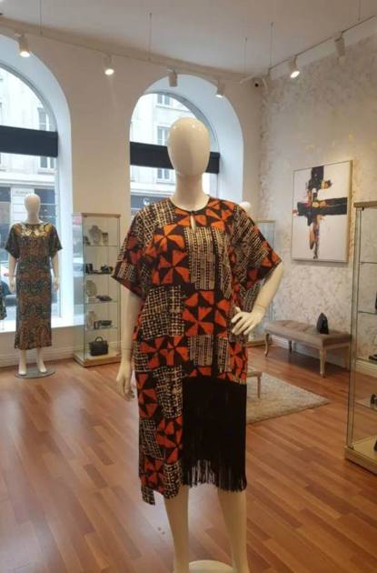 Orange and black batik tunic with fringe hem