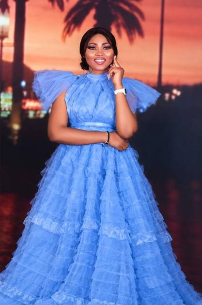 Blue tiered tulle gown styled for a portrait
