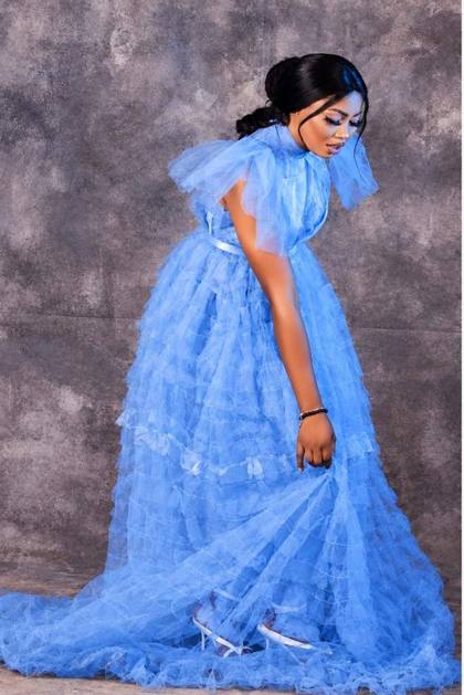 Blue tiered tulle gown with ruffle sleeves