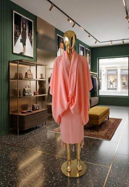 Pink draped cape top with tassel-hem skirt