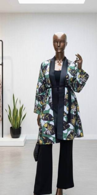 Leaf-print kimono jacket with black satin trim on a mannequin