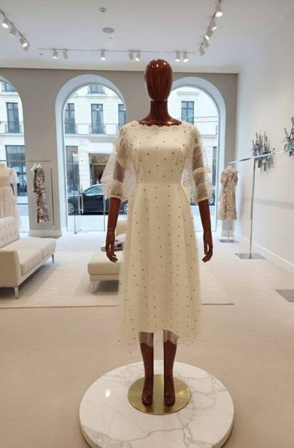 Cream polka-dot tulle dress with sheer sleeves