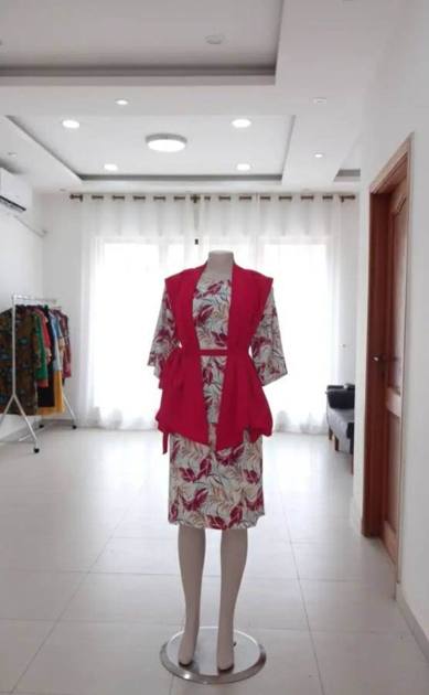 Red tie vest over floral dress